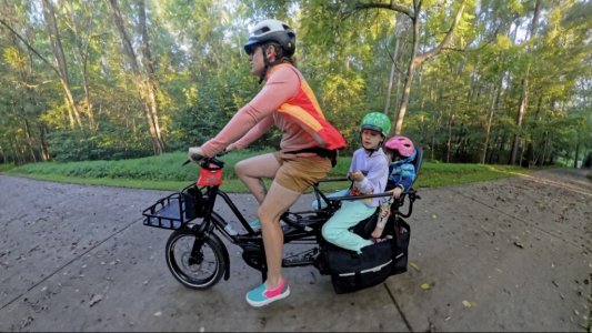 kid-cruising-on-the-tern-quick-haul-midtail-cargo-bike-1024x577.jpg